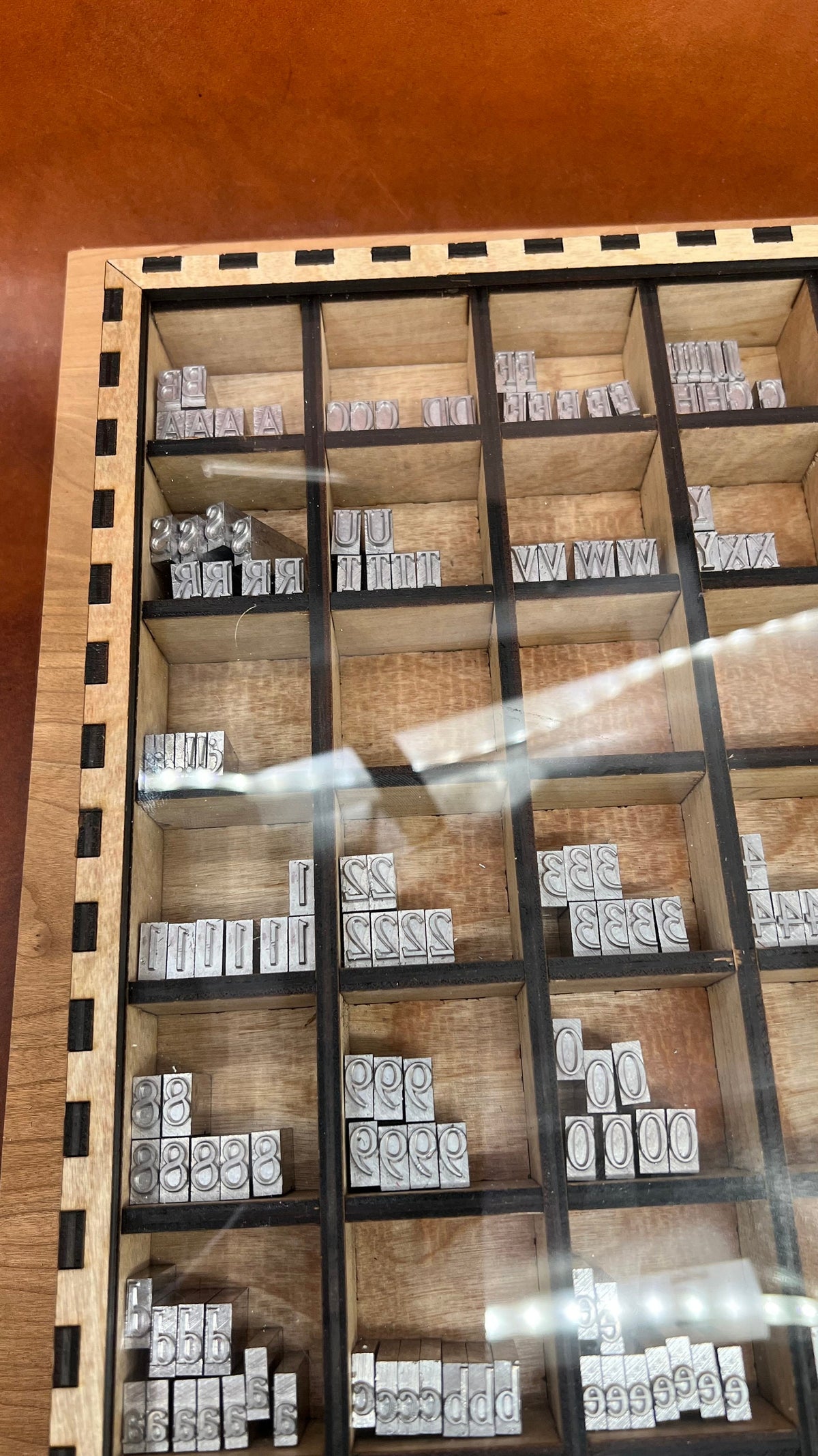 13x13 Typeset Drawer Organizer with Partitions, ideal for organizing typesets, craft supplies, and small parts. Features durable, laser-cut wood construction with multiple compartments for efficient storage and easy access.