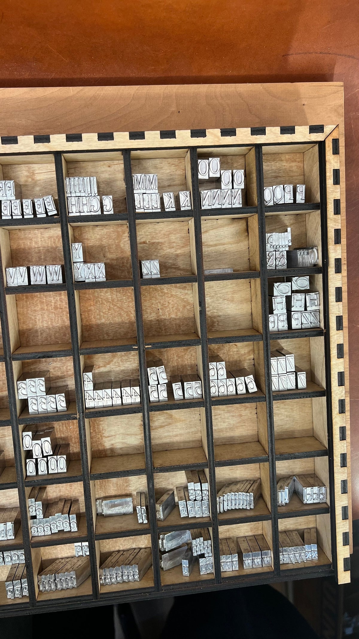 Typeset Drawer Organizer with Partitions. Made from durable, wood with multiple compartments for efficient storage and easy access. Ideal for crafters, hobbyists, and letterpress enthusiasts.